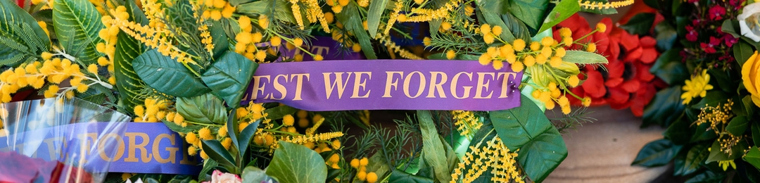 Wreaths with Lets we forget ribbons