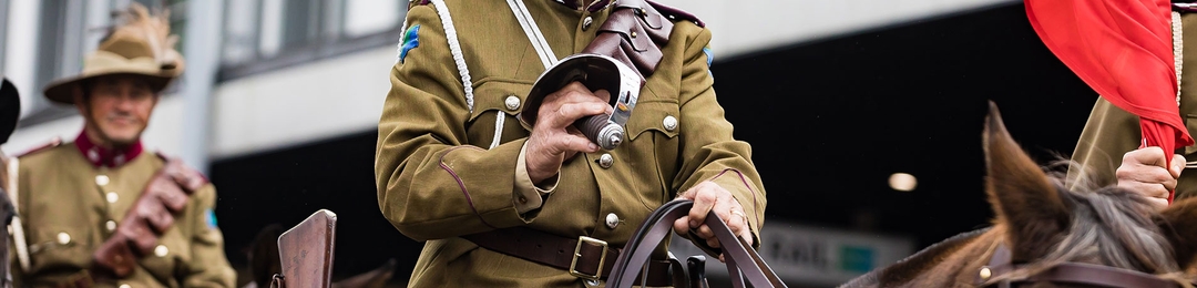 Army personnel on horse back riding in an ANZAC Day March